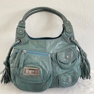 Lockheart front pocket tassel hobo bag